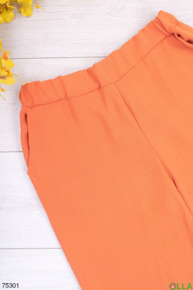 Жіночі помаранчеві брюки