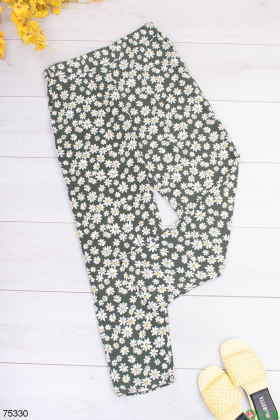 Жіночі двоколірні брюки в квітковий принт
