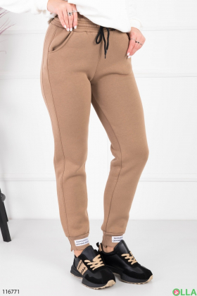 Жіночі бежеві спортивні брюки-джогери на флісі