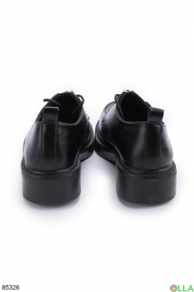 Women's black lace-up shoes