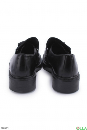 Women's black shoes with a buckle
