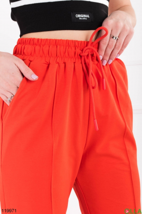 Жіночі помаранчеві спортивні брюки-палаццо