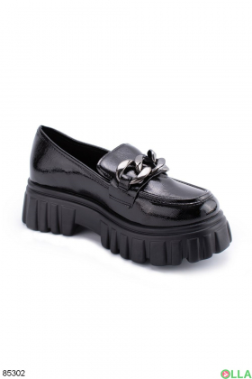 Women's black shoes with a chain