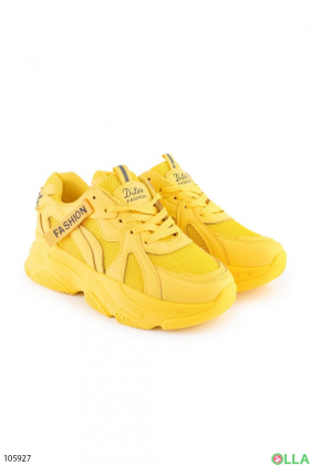Women's yellow lace-up sneakers