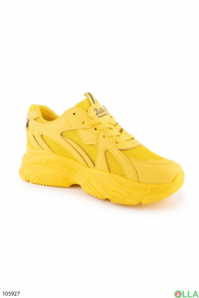 Women's yellow lace-up sneakers