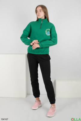 Women's green sweater with zip logo