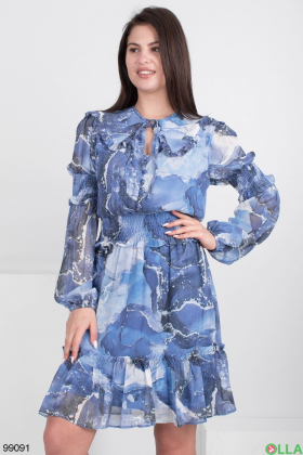 Women's blue and white dress with patterns