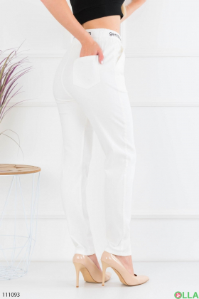 Women's white trousers with a belt