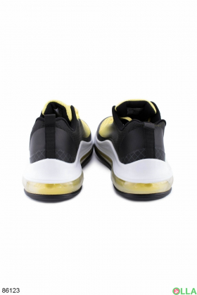 Женские черно-желтые кроссовки на шнуровке