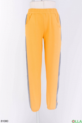 Жіночі помаранчеві спортивні брюки