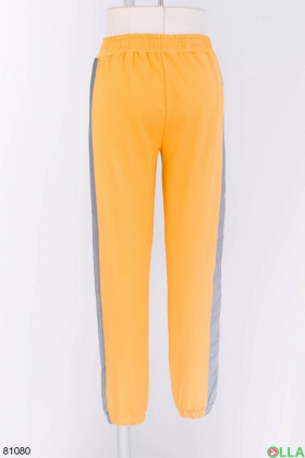 Жіночі помаранчеві спортивні брюки