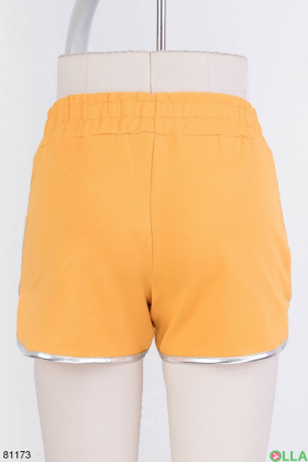 Жіночі помаранчеві спортивні шорти