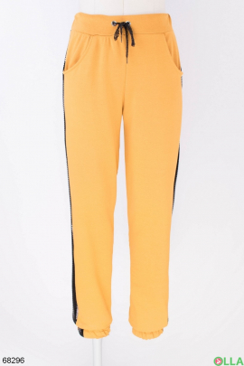 Женские оранжевые спортивные брюки 