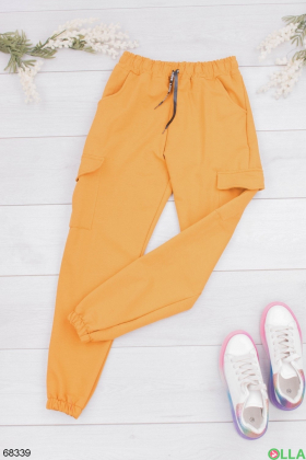 Жіночі помаранчеві спортивні штани