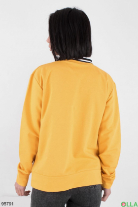 Women's yellow sweatshirt with an inscription