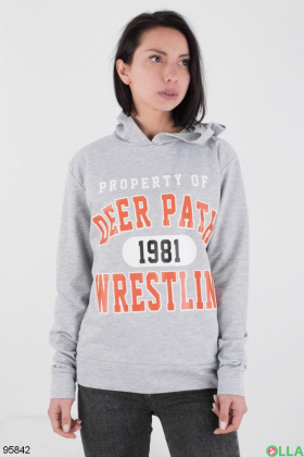 Women's light gray hoodie with slogan