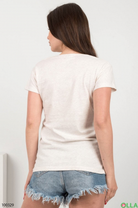 Жіноча світло-бежева футболка з написом