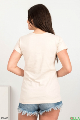 Жіноча світло-бежева футболка з малюнком