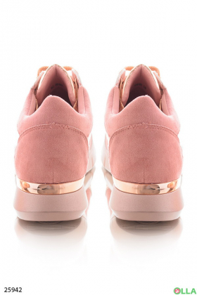 Pink sneakers with gold accents