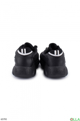 Жіночі чорні кросівки з білою смужкою