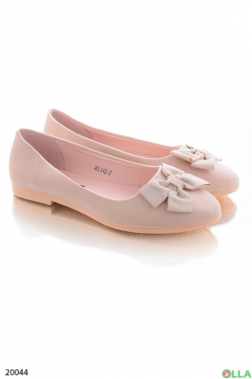 Beige ballet flats with a bow