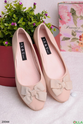 Beige ballet flats with a bow