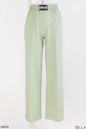 Женские зеленые спортивные брюки