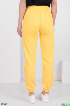 Жіночі жовті спортивні брюки