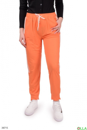 Женские оранжевые брюки с лампасами