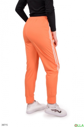 Женские оранжевые брюки с лампасами