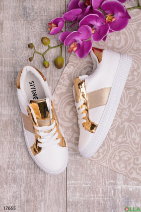 Sneakers with gold accents