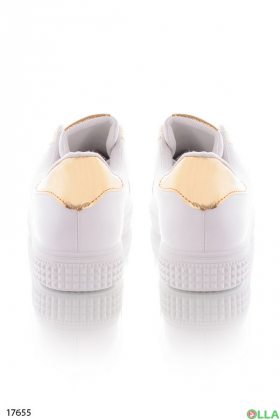 Sneakers with gold accents