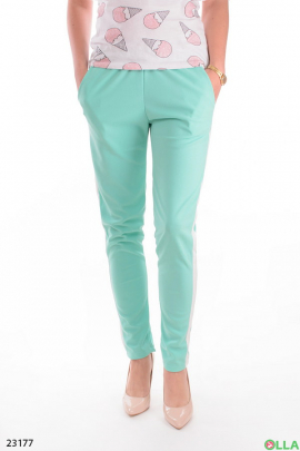 Turquoise trousers with stripes