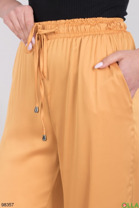 Жіночі оранжеві штани
