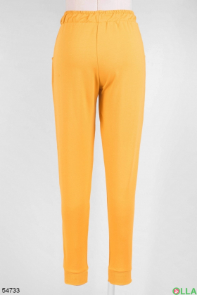 Женские оранжевые спортивные брюки