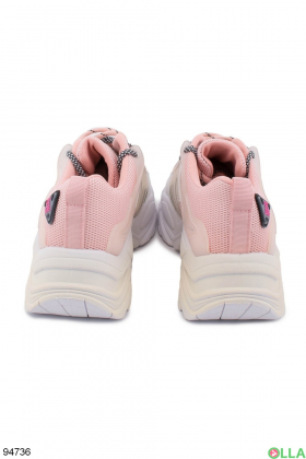Women's pink and white sneakers