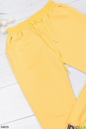 Женские желтые спортивные брюки