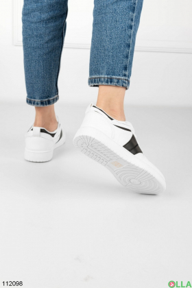 Women's black and white sneakers made of eco-leather