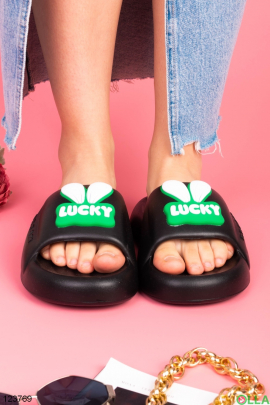Women's black slippers with decor
