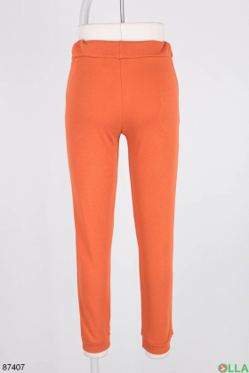 Женские оранжевые спортивные брюки