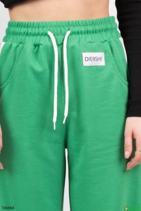 Жіночі зелені з білими вставками спортивні брюки