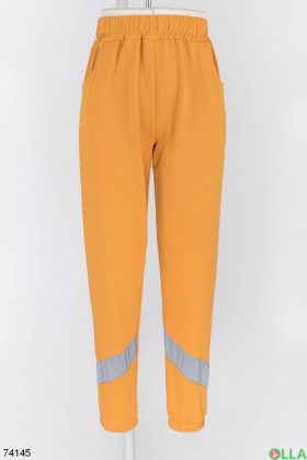 Жіночі спортивні помаранчеві брюки