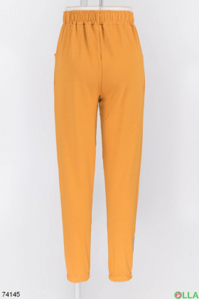 Жіночі спортивні помаранчеві брюки
