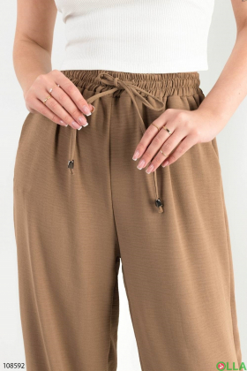 Жіночі бежеві брюки-палаццо батал