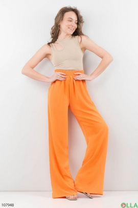 Жіночі помаранчеві брюки-палаццо