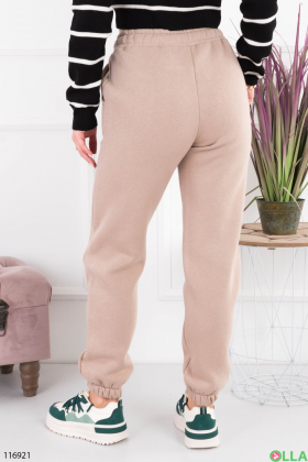 Жіночі бежеві спортивні брюки-джогери на флісі