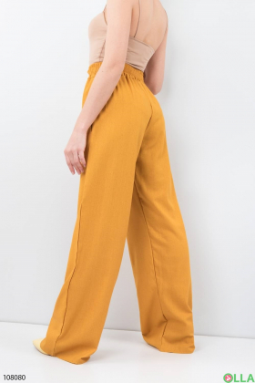 Женские оранжевые брюки-палаццо