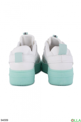 Women's white sneakers with green soles