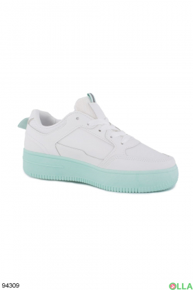 Women's white sneakers with green soles