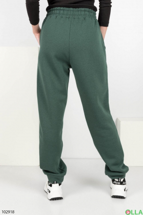 Жіночі зелені спортивні брюки на флісі